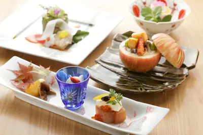 a table with three plates of food on them at Hotel Niwa Tokyo in Tokyo