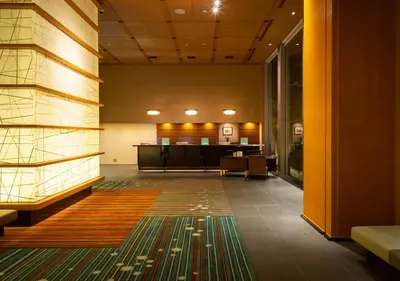 an empty lobby with a waiting room in the background at Hotel Niwa Tokyo in Tokyo