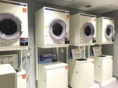 a room with several washing machines on display at Nihon Seinenkan Hotel in Tokyo