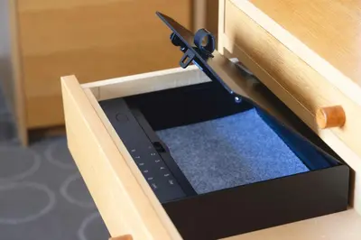a tablet in a drawer with a pair of scissors at Hotel Gracery Ginza in Tokyo