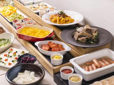 a table with many different dishes of food on it at Hotel Gracery Ginza in Tokyo