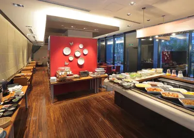 a buffet line in a restaurant with food on display at Hotel Gracery Tokyo Tamachi in Tokyo