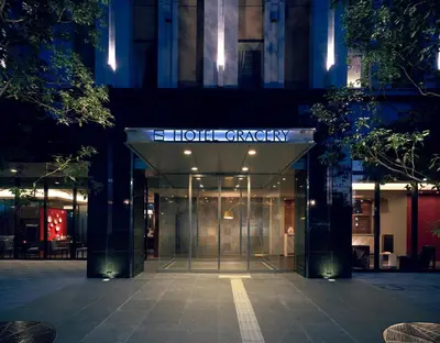a building with a sign that reads holt catalyst at Hotel Gracery Tokyo Tamachi in Tokyo