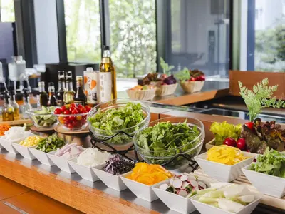 a buffet with bowls of different types of vegetables at Hotel Gracery Tokyo Tamachi in Tokyo