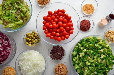 a table with bowls of vegetables and other ingredients at Tokyo Bay Ariake Washington Hotel in Tokyo