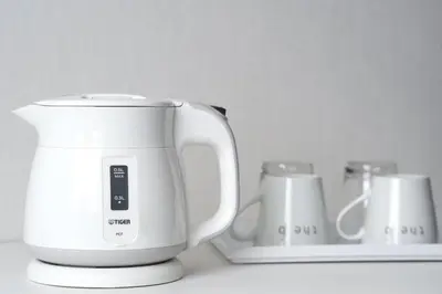 a white appliance sitting on top of a counter at the b shimbashi in Tokyo