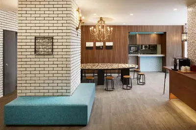 a kitchen and dining room with a brick wall at the b shimbashi in Tokyo