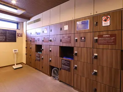 a row of lockers in a building at Dormy Inn Tokyo Hatchobori - Natural Hot Spring in Tokyo
