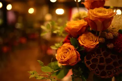 a bunch of orange roses in a vase at Sakura Fleur Aoyama in Tokyo