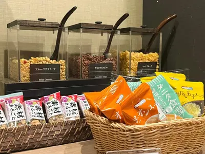 three baskets of food on display in a store at Dormy Inn Express Meguro Aobadai Hot Spring in Tokyo