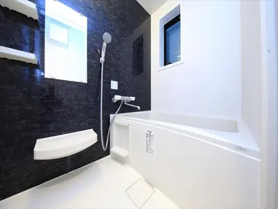 a bathroom with a white tub and a sink at COTO Tokyo Shibuya 2 in Tokyo