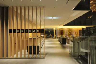 a lobby of a building with a sign on the wall at The Capitol Hotel Tokyu in Tokyo