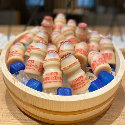 a wooden container filled with red white and blue candy at Dormy Inn Akihabara in Tokyo