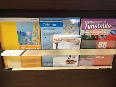 a shelf with a bunch of books on it at Hotel Horidome Villa in Tokyo
