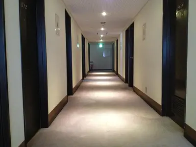 an empty hallway with a long corridor at Hotel Horidome Villa in Tokyo
