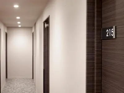 a hallway with a door with the number on it at Hotel New Tohoku in Tokyo