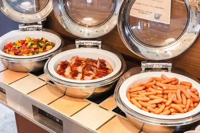 four bowls of food on a counter with food at Sotetsu Grand Fresa Tokyo-Bay Ariake in Tokyo