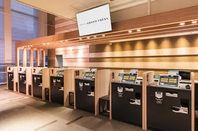 a row of cash registers in a building at Sotetsu Grand Fresa Tokyo-Bay Ariake in Tokyo