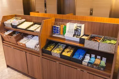 a food counter with different types of food at Hotel Sunroute Plaza Shinjuku in Tokyo