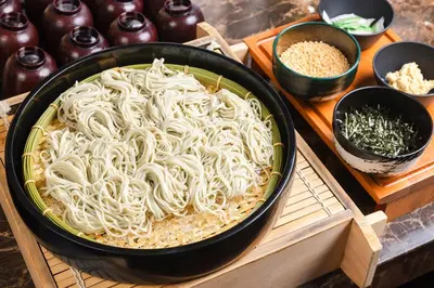 a casserole dish filled with noodles on a table at Hotel Sunroute Plaza Shinjuku in Tokyo