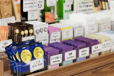 a display ofented candles on a shelf in a store at Hotel Sardonyx Ueno in Tokyo