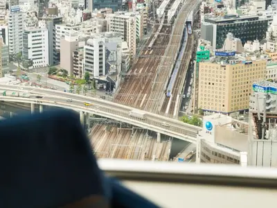 a view of a city with a bridge and freeway at Hotel Metropolitan Tokyo Marunouchi in Tokyo