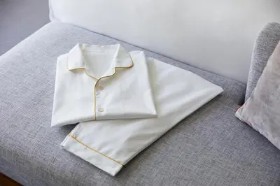 a white shirt sitting on top of a couch at Keio Plaza Hotel Tokyo Premier Grand in Tokyo