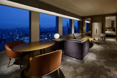 a living room with a couch and a table at Keio Plaza Hotel Tokyo Premier Grand in Tokyo