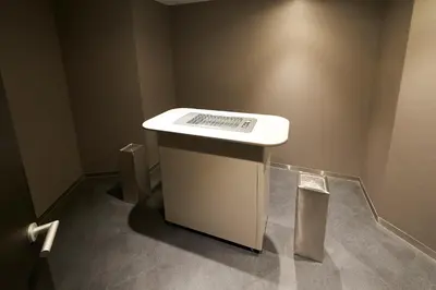 a white counter in a room with a wall at Sotetsu Fresa Inn Tokyo Roppongi in Tokyo