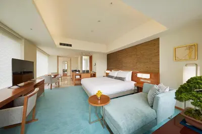 a hotel room with a bed and a couch at THE KITANO HOTEL TOKYO in Tokyo