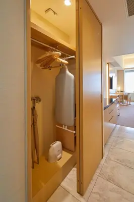 a walk in closet with a large glass door at THE KITANO HOTEL TOKYO in Tokyo