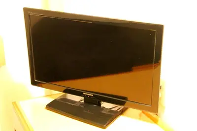 a computer monitor sitting on top of a table at Smile Hotel Tokyo Shinkoiwa in Tokyo