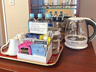 a tray with a tea kettle and other items on a counter at Shibuya Creston Hotel in Tokyo