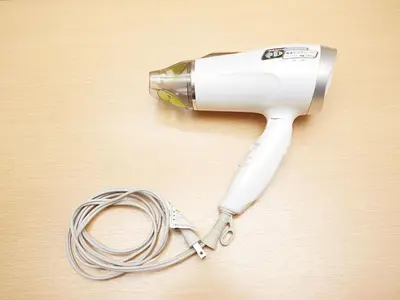 a hair dryer sitting on top of a table at KOKO HOTEL Korakuen - formerly Hotel Wing International Korakuen in Tokyo