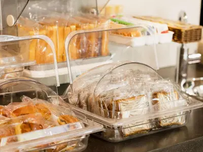 a bunch of plastic containers of food on a counter at KOKO HOTEL Korakuen - formerly Hotel Wing International Korakuen in Tokyo