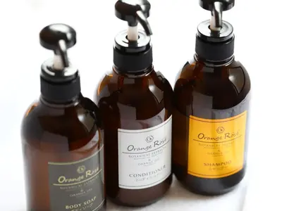 a group of four bottles of sauce on a counter at KOKO HOTEL Korakuen - formerly Hotel Wing International Korakuen in Tokyo