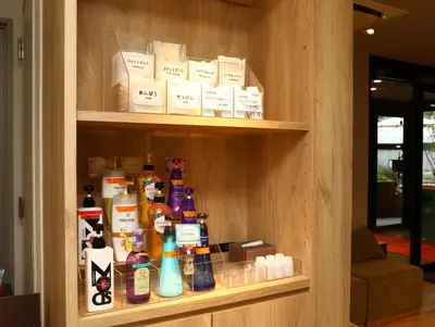a shelf filled with lots of bottles of medicine at KOKO HOTEL Korakuen - formerly Hotel Wing International Korakuen in Tokyo