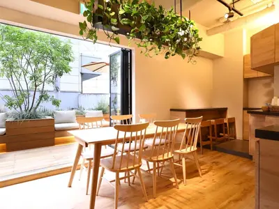 a kitchen and dining room with a table and chairs at KOKO HOTEL Korakuen - formerly Hotel Wing International Korakuen in Tokyo