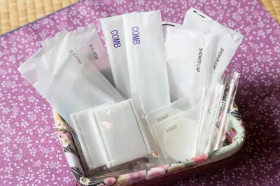 a basket filled with packets of tooth brushes and other items at Guest House Wagokoro in Tokyo