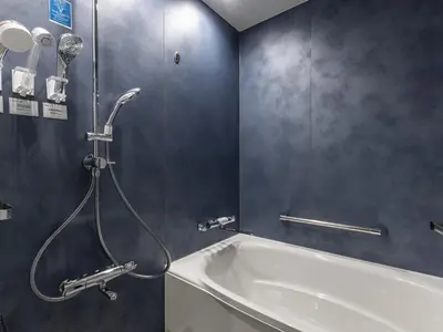 a bathroom with a shower and a bath tub at Tokyu Stay Nishi Shinjuku in Tokyo