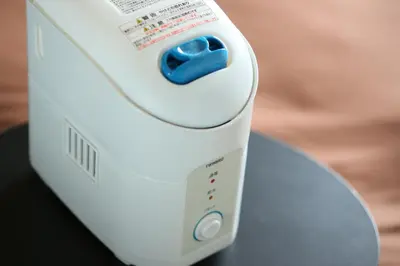 a white electric hair dryer sitting on a table at Urbain Tokyo Haneda Kamata in Tokyo
