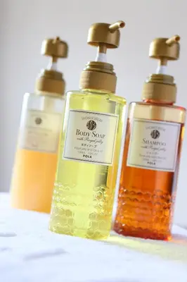 three bottles ofjoy spa liquids sitting on a table at Urbain Tokyo Haneda Kamata in Tokyo