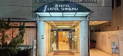 a building with a sign on the front of a store at Hotel Listel Shinjuku in Tokyo