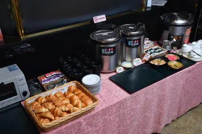 a table with a pink table cloth with pastries on it at Hotel Listel Shinjuku in Tokyo