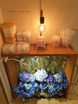 a table with blue and white flowers on it at EN Hotel Shibuya in Tokyo