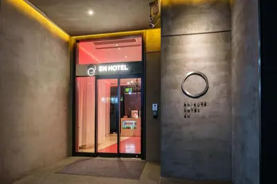 a entrance to a store with a sign on the door at EN Hotel Shibuya in Tokyo