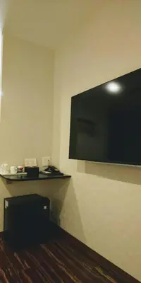 a flat screen tv on the wall of a hotel room at Ueno First City Hotel in Tokyo