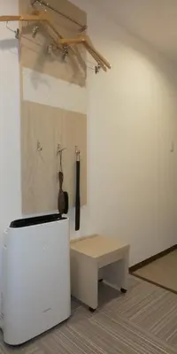 a room with a table and a bench in it at Ueno First City Hotel in Tokyo