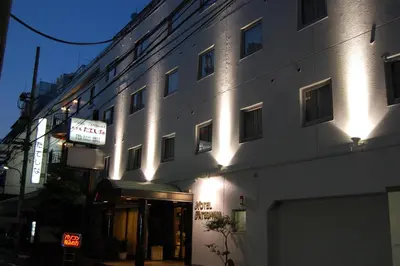 a building with lights on the side of it at Hotel Tateshina in Tokyo
