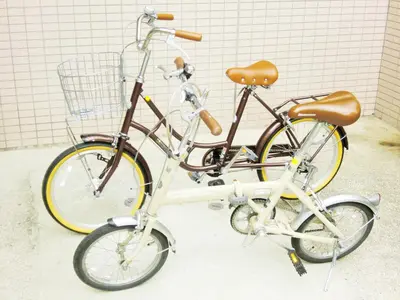 two bikes are parked next to each other at Hotel Park Avenue in Tokyo